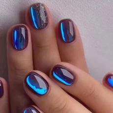 Short blue false nails with aurora glitter, designed in a ballet French style. These wearable fake nails provide a milky way effect and offer full coverage. They are easy to press on and come with nail tips for added convenience. 24pcs