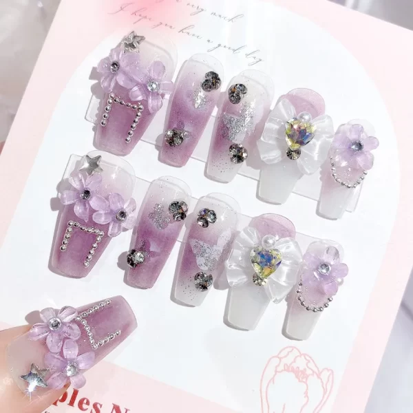 24 pieces of press on nails decorated with butterfly flowers. These luxury acrylic press-on nails are adorned with rhinestones and can be easily removed. They come with glue for easy application. - Image 2