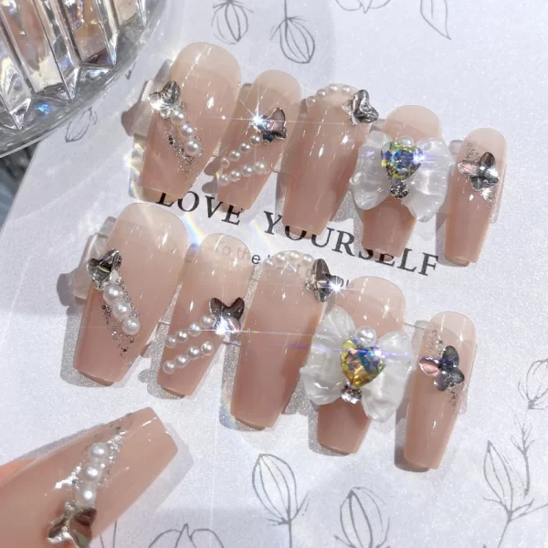 24 pieces of press on nails decorated with butterfly flowers. These luxury acrylic press-on nails are adorned with rhinestones and can be easily removed. They come with glue for easy application. - Image 4