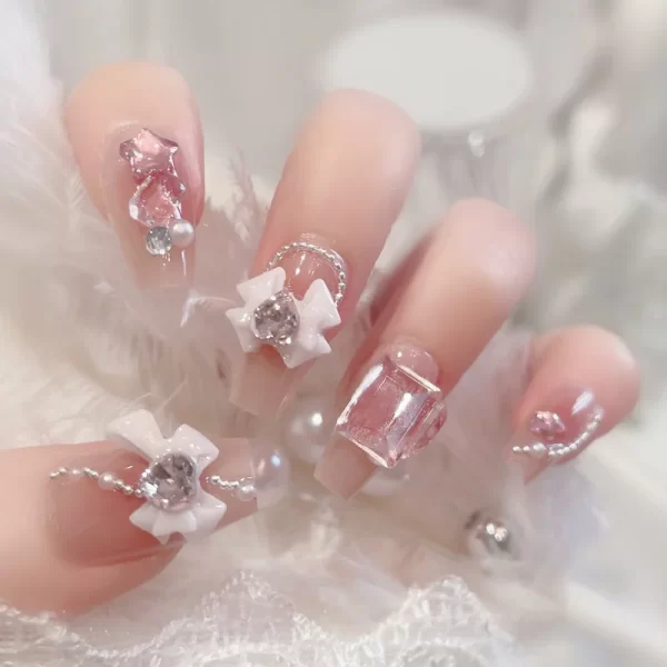 24 pieces of press on nails decorated with butterfly flowers. These luxury acrylic press-on nails are adorned with rhinestones and can be easily removed. They come with glue for easy application. - Image 5