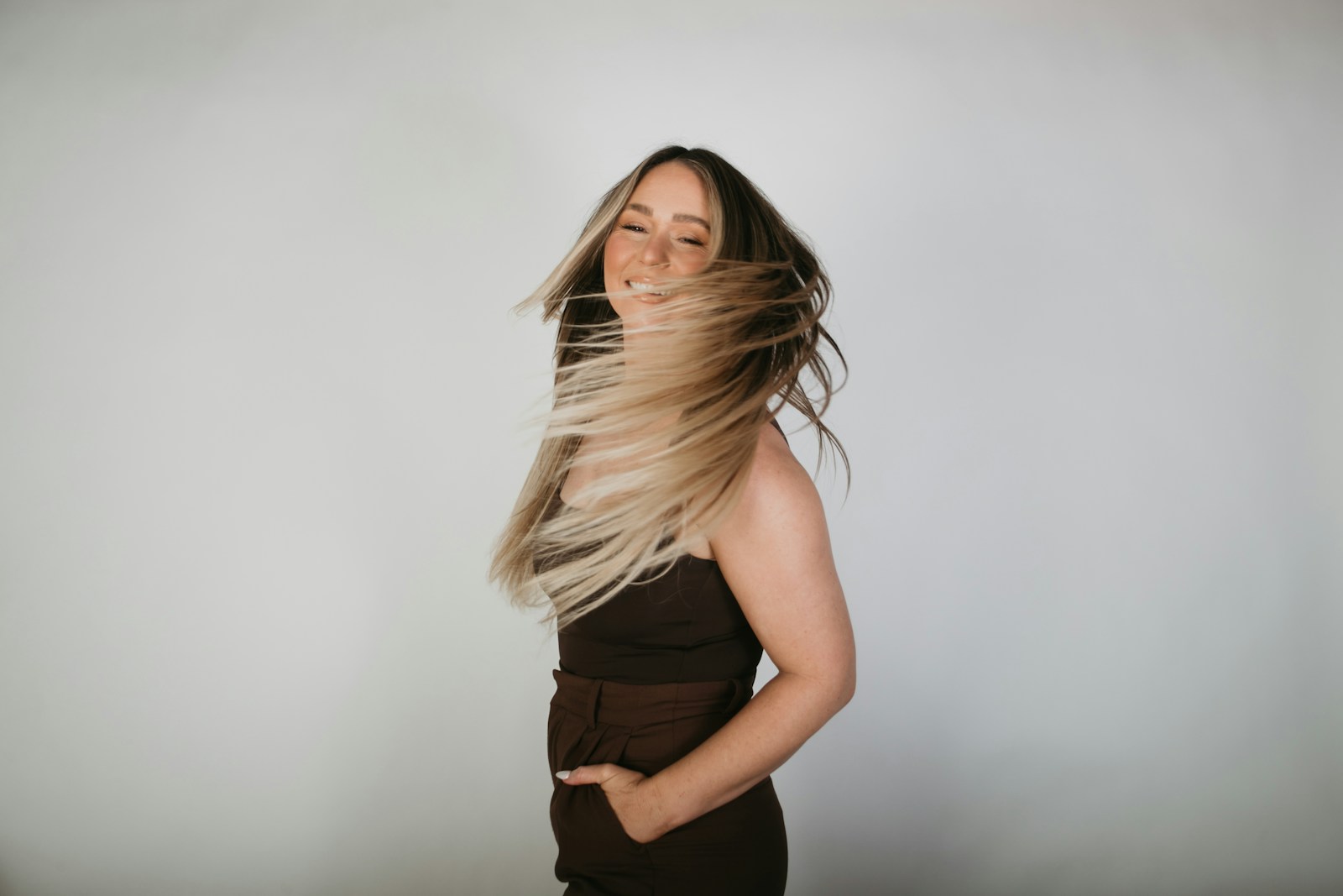 a woman with her hair blowing in the wind